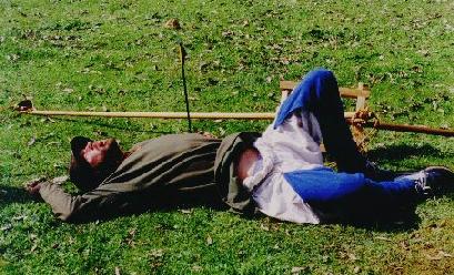John lies sprawled on the sheep-dropping infested ground with a broken Jake beside him.... photo by Kate